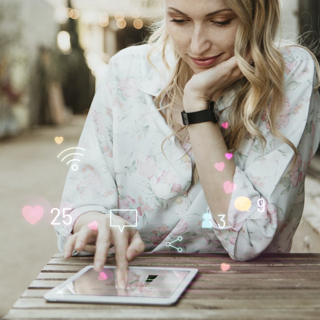 Happy woman using social media on a tablet