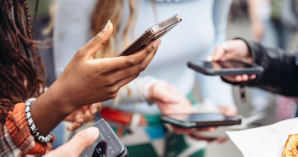 The Secret to High-Performing Instagram and Facebook Ad Campaigns 1 Group of friends using smartphones for social media and online engagement
