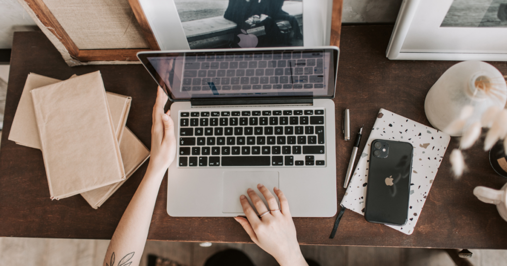 Person on a laptop with SEO representing local search optimization strategy in Kansas City